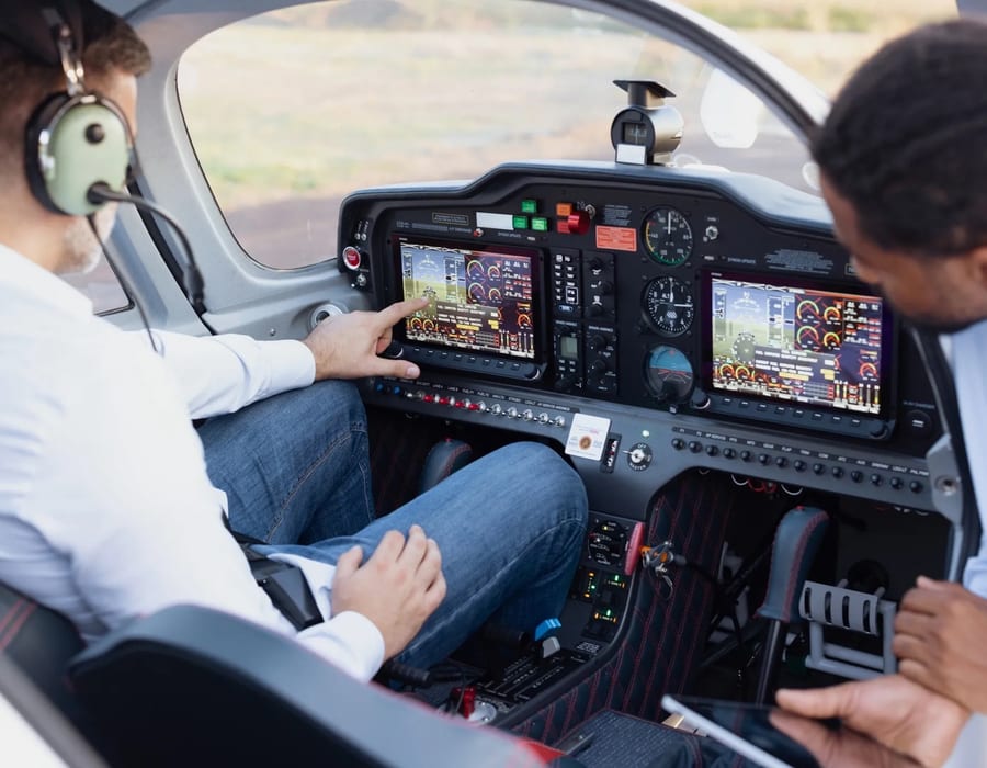 Business jet cockpit with glass-panel avionics — illustrative stock photo