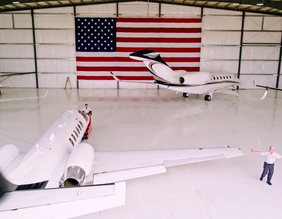 Business jet parked on airport apron — illustrative stock photo